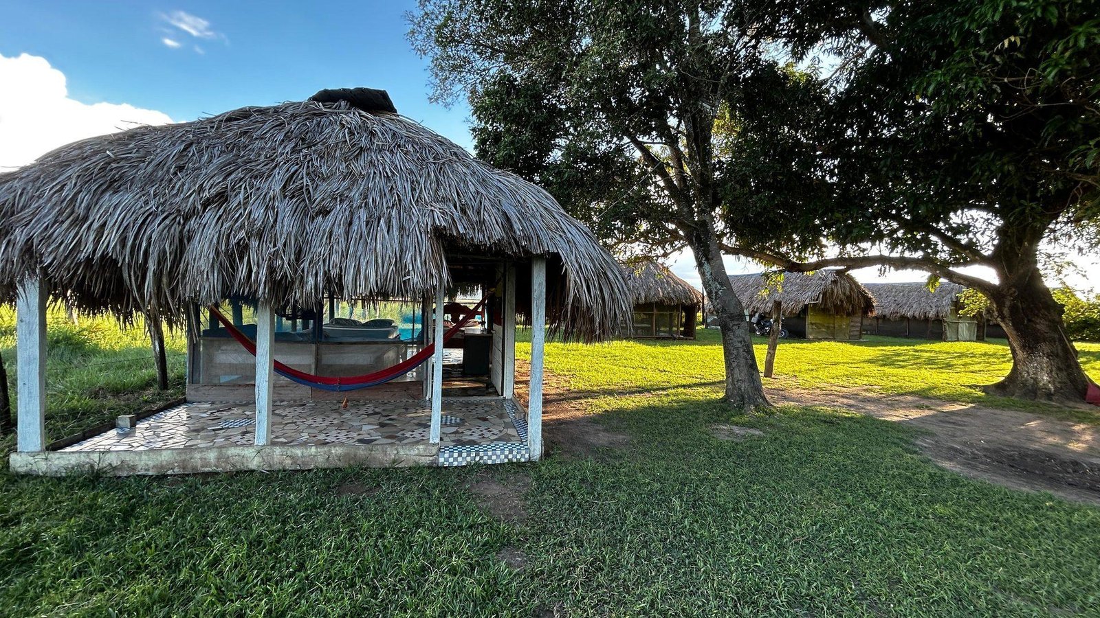 Family palm cabin with hammock